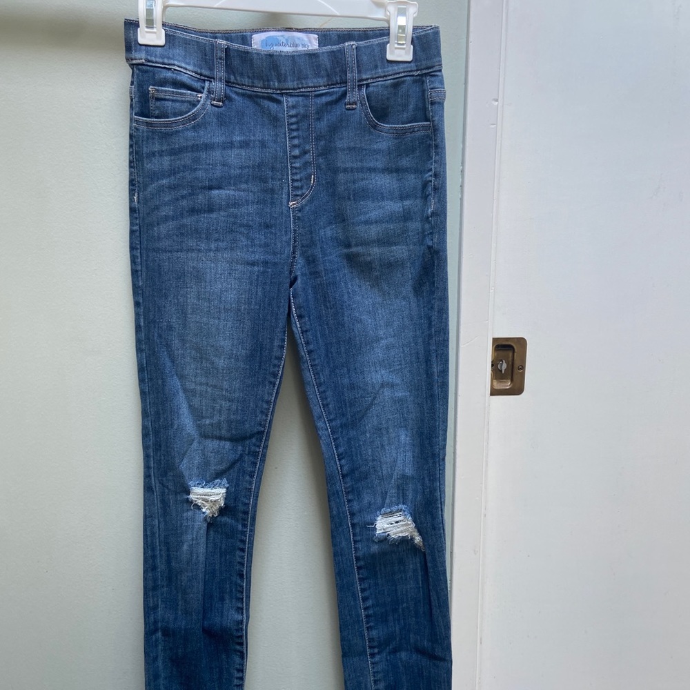 Medium blue wash skinny jeans with knee rips